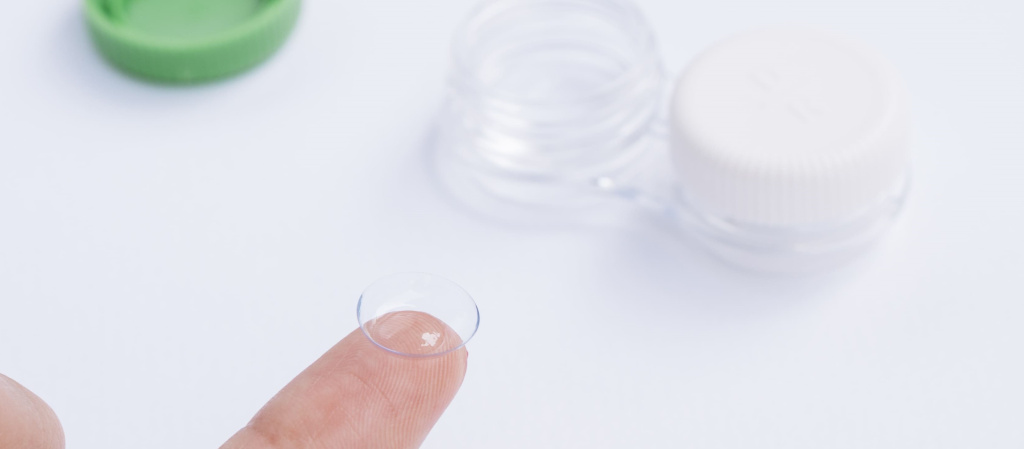 female-showing-contact-lenses-his-finger (1).jpg